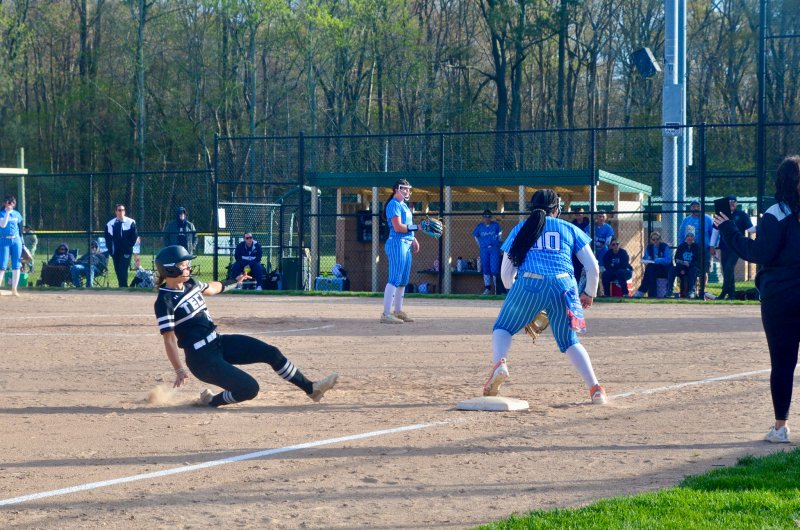 Sussex Tech senior Paige Krepps slides into third base during the Ravens’ 9-0 win over Cape April 9. AARON R. MUSHRUSH PHOTOS