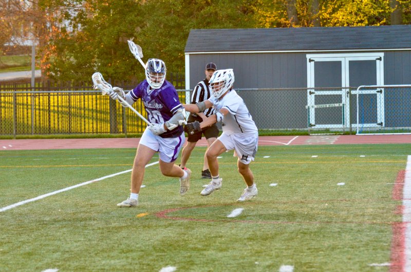 Sussex Academy sophomore Ty Jarrell has to deal with a check to his back.