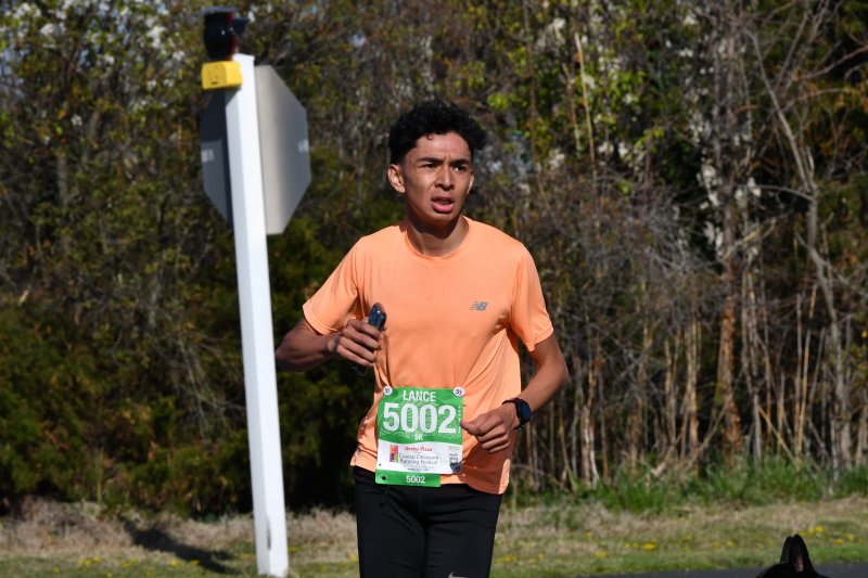 Lance Jayme runs to a time of 17:25 to finish second in the 5K.