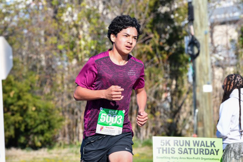 Kyle Jayme takes third in the 5K with a time of 18:07.