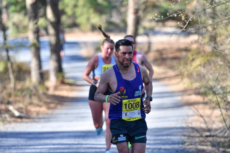 Francisco Puac runs to a time of 1:26:02 in the half-marathon.