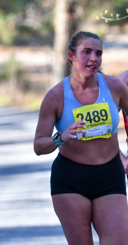 Sofia LoVuolo wins the women’s half-marathon race in 1:28:59.