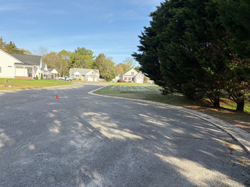 The area around the stormwater retention pond where a sidewalk was originally planned to go.