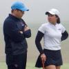 DSU women’s golf team coach Rick McCall Jr. talks with golfer May Chimsuti on the foggy Naval Academy Golf Course during the Navy Invitational Tournament held April 13-14. DSU finished in fifth place. FRITZ SCHRANCK PHOTO