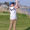 Jeremy Trost watches his tee shot on the 19th hole at Rehoboth Beach CC during an April 30 practice session for the Cape Henlopen High School golf team. FRITZ SCHRANCK PHOTO