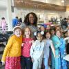 Love Creek Principal Equetta Jones stands with some of her students in the school cafeteria. In back are (l-r) Jones and students Olivia Hunt, Eleanor Orlando and Julien Hoshaw. In front are Kinsley Apgar, Mea Clayton, Melanie Smith, Tessa Okolowicz, Adriana Rodriguez and Olivia Deptula. ELLEN MCINTYRE PHOTOS