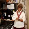 Lewes Councilwoman Trina Brown-Hicks stands in front of her new stove, holding the talking carbon monoxide detector she said saved her life Nov. 6. Brown-Hicks said the stove was not installed correctly and caused a leak that set off her detectors. BILL SHULL PHOTOS