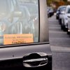 A funeral procession sign is displayed on the window of a car in line at the Cape May-Lewes Ferry Terminal in Lewes. BILL SHULL PHOTOS