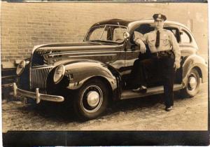 This photograph from the Futcher family shows Lewes Police Officer Charles W. Futcher Sr. in the late 1930s next to his patrol car. SOURCE SUBMITTED