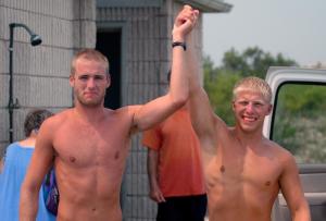 Baked and fried, Andrew Rogan, left, and Rob Campbell celebrate the accomplishment of their mission of running a complete marathon on the beach. BY DAVE FREDERICK