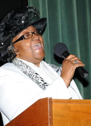 The Rev. Grace Ruth Batten, president of CHEER's board of directors, welcomes the crowd and tells them, "People rely on us. We help them stay in their homes. I am so very proud of the work we do."