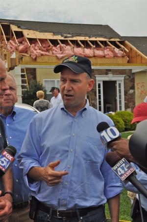 Gov. Jack Markell and other state and county officials conduct a press conference in front of the Holloway house. Officials toured the region to assess storm damage. BY RON MACARTHUR