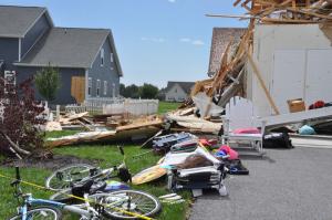 Debris is scattered into neighboring yards throughout Nassau Station. BY RON MACARTHUR