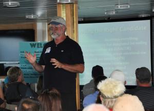 Jeffery Tinsman, Delaware artifical reef program manager for the Department of Natural Resources and Environmental Control's Division of Fish and Wildlife, lectures the former crew, media, state and federal officials on the process of choosing the reefing candidates.