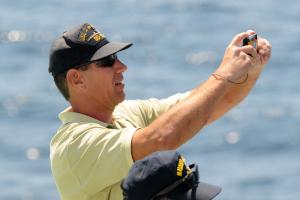 Former crew member Lee String takes a remembrance shot of the sinking destroyer. String served as a hull maintenance tech on the warship.