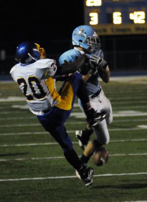 Cape's Cody Dmiterchik battles Central's Gregory Taylor for a Diaz Nardo pass. BY DAN COOK