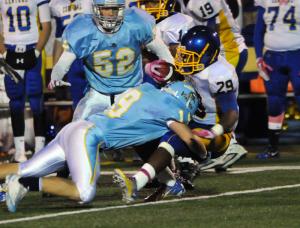 Cape sophomore linebacker Luke Benson puts a hard hit on Central's Brandon Lewis. BY DAN COOK