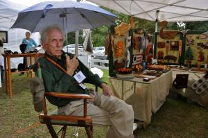 Craftsman Jack O'Brien of Centreville, Md., displays some of his Woodwhims folk art during the crafts fair sponsored by the Lewes Historical Society. BY RON MACARTHUR