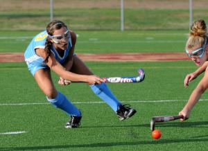 Cape sophomore Kat Judge passes into the scoring circle. BY DAN COOK