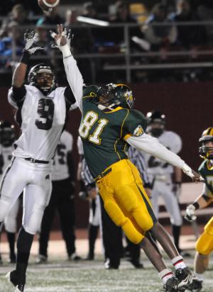 Indians defensive end No. 81 Davonte Waters breaks up a pass intended for Caravel's No. 9 Pierce Ripanti. BY DAN COOK