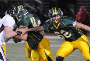 Indian River sopomore center No. 64 Joost Elling blocks out a Caravel defensive lineman as big brother No. 62 Kees waits for his turn at hitting a charging Buc. Indian River quarterback Jermyll Jarmon had ample time to find receivers throughout the game thanks to the play of his offensive line. BY DAN COOK