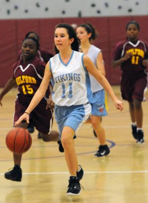 Mariner guard Kiya Cochirn moves the ball upcourt against the Bucs. BY DAN COOK