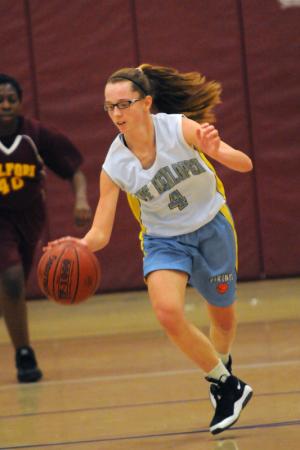 Marrissa Howcroft starts a fast break in the third quarter. She finished the game with three points for the Lady Vikes. BY DAN COOK