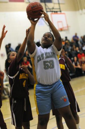 Mariner forward Angel Cox goes up strong for the Vikings. BY DAN COOK