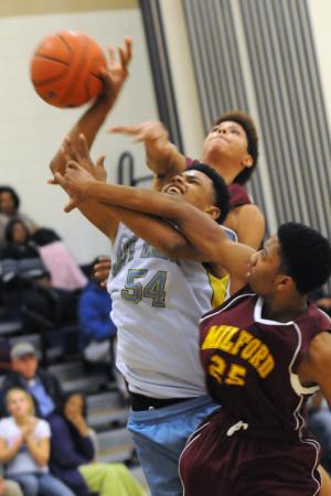 Mariner's Jerimiah Smack is fouled going to the hoop. BY DAN COOK