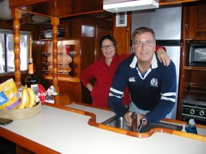 Rebecca Maywald and Craig Butler in the galley of the vintage yacht they plan to restore. The vessel, Juneve, sustained engine damage when Butler and a friend were cruising from New York to Virginia where the couple lives. After the boat was towed to Lewes for repairs, the couple found they loved the city’s ambiance. BY HENRY J. EVANS JR.
