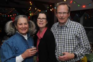 Under the lights and having fun are (l-r) Joan Beck and Anne and Steve Hanzell. BY STEVEN BILLUPS