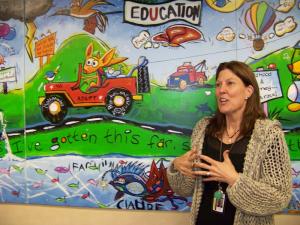 Family Court Chief Justice Chandlee Kuhn congratulates the kids on the painting. BY RYAN MAVITY