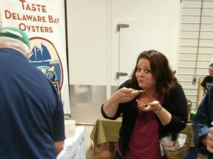 Event planner Karen Forst takes a moment from the festivities to enjoy a Delaware Bay oyster. BY MOLLY MACMILLAN