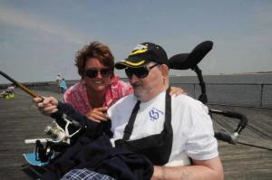 Veteran Tom Locke gets some help from his favorite Post 17 volunteer Nancy Caras. BY STEVEN BILLUPS