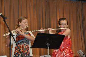 To start off the concert, fifth-graders Alaina Watts and Madison Metcalf play their flutes. BY RON MACARTHUR