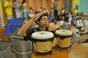 Ivan Alonso, part of the Shields fifth-grade band percussion unit, plays the bongos. BY RON MACARTHUR