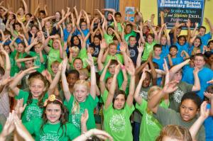 Third-grade chorus members join together to perform "YMCA." BY RON MACARTHUR