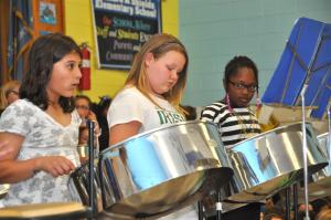 Anna Stancofski, Breana Hathaway and Cay’la Laws play the steel drums to end the annual spring concert. BY RON MACARTHUR