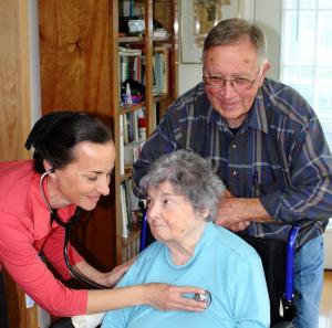 Donna Pritchett, left, works with hospice clients Pat Maxwell, seated, and Pat's husband, Skip. SOURCE SUBMITTED