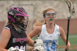 Regan Shanahan rags the EVO goalie BY DAVE FREDERICK