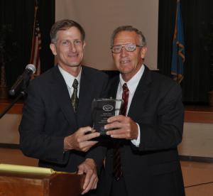 Sussex County Councilman Vance Phillips, left, receives the PGA Individual Freedom Award from Executive Director Rich Collins. BY RON MACARTHUR