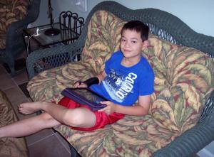 Eight-year-old Thomas Fleming from Atlanta, Ga. used his dad’s laptop computer and iPad tablet computer to play math and video games.