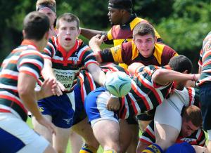 UD senior Mitch Vannoy passes the ball after a scrum. BY DAN COOK