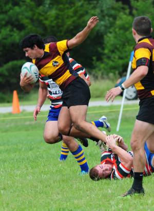 A Salisbury runner pulls away from a UD tackler. BY DAN COOK