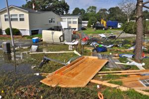Debris from damaged homes is scattered all over the area. BY RON MACARTHUR