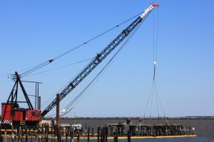 A crane will pull up sections of the pier. BY MELISSA STEELE