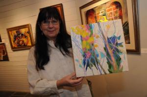 Gail Powell, who recently joined the Rehoboth Art League, shows her first submitted art work titled “Woodland Traces.” BY STEVEN BILLUPS