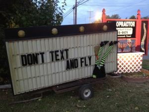 Cool roadside sign in Lewes showing what happens to witches who text.