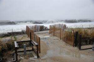 The water has breached the Boardwalk in front of the Henlopen Hotel in Rehoboth Beach. BY NICK ROTH