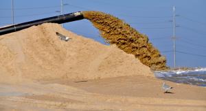 DNREC's goal is to pump at least 100,000 cubic yards of sand each year from the south side to the north side of the Indian River Inlet beach. BY RON MACARTHUR